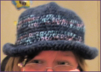 Blue crocheted hat with brim